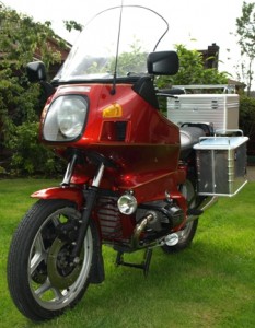 Bertha Picture of the red motorcycle named Bertha sat in the garden looking very shiny.