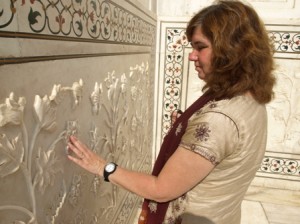 Picture of Cathy exploring the craftsmanship of the marble flowers.