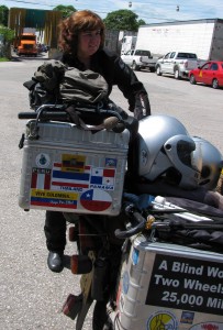 Picture of Cathy at the rear of the bike with the disinfectant 'car-wash' behind her - top left hand side. 