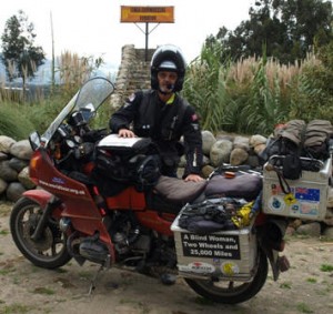 Picture of Bernard in the car park by Bertha with the Equatorial sign behind him.